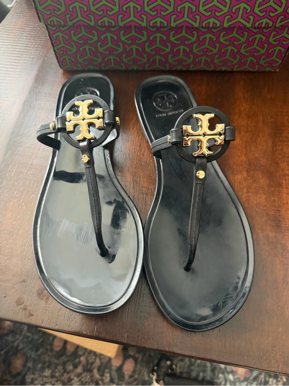 Tory Burch Black Jelly Thong Sandals with Gold Logo Medallion